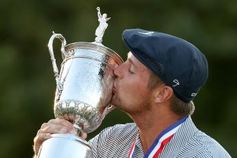 Bryson DeChambeau kisses the championship trophy in celebration after winning the 120th U.S. Open Championship on Sunday at Winged Foot Golf Club in Mamaroneck, NY. (GREGORY SHAMUS/Getty Images/TNS)