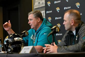 Jaguars head coach Doug Marrone (left) and general manager Dave Caldwell talk about next season during a press conference on Dec. 31, 2019 at TIAA Bank Field in Jacksonville. (WILL DICKEY/TNS) 