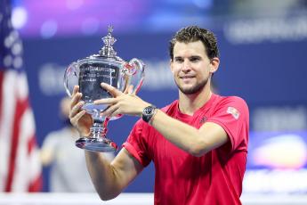 Dominic Thiem celebrates with the championship trophy after winning in a tie-breaker during his Men's Singles final match against Alexander Zverev on Day 14 of the 2020 U.S. Open at the USTA Billie Jean King National Tennis Center on Sunday, in the Queens borough of New York City. (MATTHEW STOCKMAN/Getty Images/TNS)