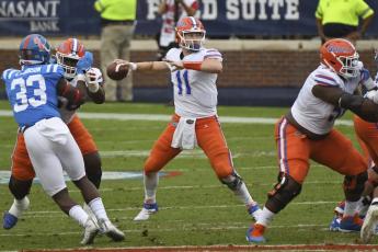 Florida quarterback Kyle Trask (11) releases a pass against Mississippi on Saturday, in Oxford, Miss. (THOMAS GRANING/Associated Press)