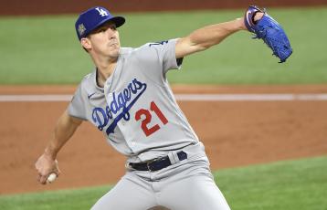 Los Angeles starter Walker Buehler pitches against Tampa Bay in the third game of the World Series on Friday night in Arlington, Texas. (WALLY SKALIJ/Los Angeles Times/TNS)
