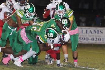 Suwannee’s defense converges for a tackle against Wakulla on Friday night. (PAUL BUCHANAN/Special to the Reporter)