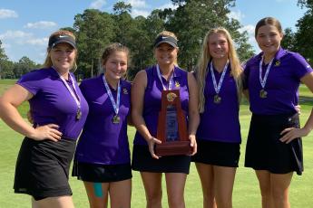 Columbia’s girls golf team won the District 2-2A title on Tuesday at Quail Heights. Pictured are Reece Chasteen (from left), Kayla Hardy, coach Tammy Winnett, Payton Gainey and Ashley Nelson. (COURTESY)