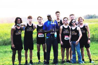 Columbia’s cross country team is pictured with coach Lawrence Davis after winning the Tiger Run at Alligator Lake on Thursday. (SHELBY CONKLIN/Special to the Reporter)