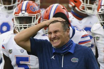 Florida head coach Dan Mullen reacts during the second half a game against Mississippi on Seot. 26 in Oxford, Miss.Mullen was given several more chances Monday to walk back bizarre comments about wanting to pack 90,000 screaming fans inside Florida Field during the coronavirus pandemic. He declined each of them, brushing aside criticism and insisting he's focused on defending national champion LSU. (THOMAS GRANING/Associated Press)
