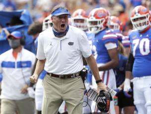 Florida head coach Dan Mullen yells to a referee about a call during a game against South Carolina on Oct. 3 in Gainesville. (AP POOL FILE PHOTO)