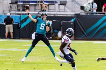 Jacksonville Jaguars quarterback Jake Luton (6) passes on the run in the first quarter against the Texans. (MATT PENDLETON/TNS)