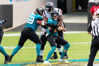 Houston Texans inside linebacker Zach Cunningham (41) tackles Jacksonville Jaguars quarterback Jake Luton (6) in the second quarter on Sunday in Jacksonville. (MATTHEW PENDLETON/TNS)
