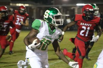 Suwannee’s Jay Smith returns a kickoff against Terry Parker during Friday’s Region 1-5A playoff game. (JAMIE WACHTER/Lake City Reporter)