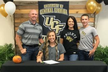 Suwannee catcher Carson Frier is pictured with her father, Todd (left), mother, Carmon (middle right) and brother Koy (far right) after signing her letter of intent with UCF on Wednesday. (COURTESY)
