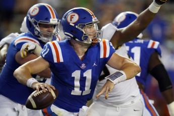 Florida quarterback Kyle Trask (11) looks for a receiver against Missouri on Saturday in Gainesville. (JOHN RAOUX/Associated Press)