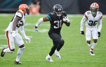 Jacksonville Jaguars running back James Robinson (30) breaks away for a 27-yard gain against the Cleveland Browns at TIAA Bank Field on Sunday in Jacksonville. (BOB SELF/TNS)