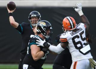 Jacksonville Jaguars quarterback Mike Glennon (2) tries to get off a pass under pressure against the Cleveland Browns at TIAA Bank Field on Sunday in Jacksonville. (BOB SELF/TNS)