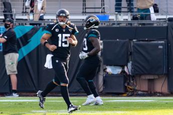 Jacksonville Jaguars quarterback Gardner Minshew (15) runs off the field after throwing a touchdown against the Tennessee Titans at TIAA Bank Field on Sunday in Jacksonville. (MATT PENDLETON/TNS)