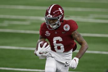 Alabama wide receiver DeVonta Smith (6) gains yardage after a catch in the first half of the Rose Bowl against Notre Dame on Jan. 1 Arlington, Texas. (ROGER STEINMAN/Associated Press)