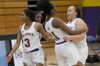 Columbia forwards Zimora Owens (left) and Amaiya Callum (right) celebrate after Callum’as game-winner  against Buchholz on Tuesday night. (JORDAN KROEGER/Lake City Reporter)