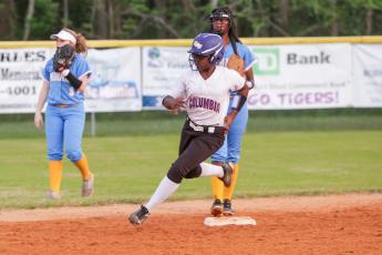 Columbia’s Zoryanna Hughes rounds second base to head towards third in a game against Chiefland last season. (FILE)