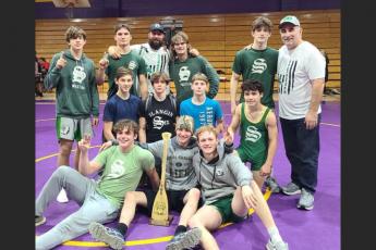 Suwannee's wrestling team poses in celebration after defeating Columbia on Wednesday. (COURTESY)