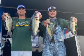 FGC’s Seth Slanker (left) and Jackson Swisher (right) pose with their winning fish at the Florida Bass Nation Bassmaster College Series qualifier on Lake Okeechobee on Saturday. (COURTESY)