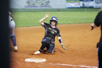 Columbia right fielder Caitlyn O’Sullivan slides safely into third base against Bell on Tuesday night. (BRENT KUYKENDALL/Lake City Reporter)