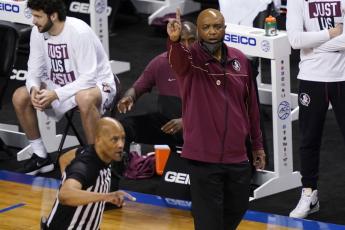 Florida State head coach Leonard Hamilton directs his team during the first half of a game against North Carolina in the semifinal round of the Atlantic Coast Conference Tournament on March 12 in Greensboro, N.C. (GERRY BROOME/Associated Press)