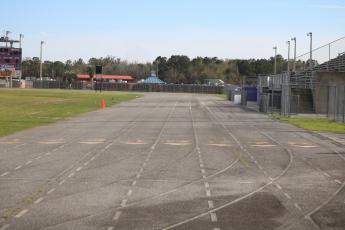 Columbia High School's track is overdue for an upgrade, one coach Lawrence Davis hopes to make happen at a meeting on March 11. (JORDAN KROEGER/Lake City Reporter)