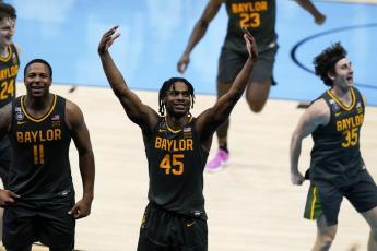 Baylor guard Davion Mitchell (45) celebrates at the end of the championship game against Gonzaga in the men's Final Four in the NCAA Tournament at Lucas Oil Stadium on Monday in Indianapolis. Baylor won 86-70. (DARRON CUMMINGS/Associated Press)