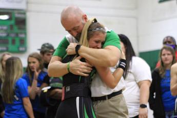 Suwannee weightlifter Matti Marsee hugs her father and assistant coach Dan Marsee after winning the Class 1A state title in the 110-pound weight class on Feb. 12. (PAUL BUCHANAN/Special to the Reporter)