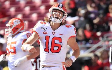 Clemson quarterback Trevor Lawrence (16) celebrates after a touchdown against Louisville at Cardinal Stadium on Oct. 19, 2019, in Louisville, Ky. (ANDY LYONS/Getty Images/TNS)