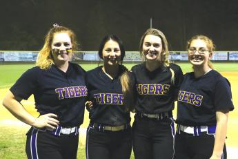 Columbia seniors Reece Chasteen (from left), Sofia Arata, Anissa Penniman and Caitlyn O’Sullivan helped lead the Tigers to a 13-3 over Hamilton County on Senior Night. (MORGAN MCMULLEN/Lake City Reporter)