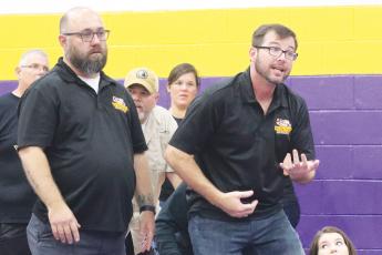 Columbia wrestling coach Pete Whittington (right) yells out instructions to a wrestler during the Tiger Duals in 2020. (JORDAN KROEGER/Lake City Reporter)