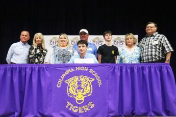 Columbia outfielder/catcher Bryant Green is pictured with his family after signing his letter of intent with Trinity Baptist College on Thursday afternoon. (JORDAN KROEGER/Lake City Reporter)