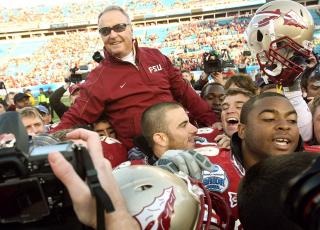 Former Florida State coach Bobby Bowden is carried triumphantly on the shoulders of his players after beating West Virginia, 33-21, in the Gator Bowl at Jacksonville Municipal Stadium on Jan. 1, 2010, in Jacksonville. (STEPHEN M. DOWELL/TNS)
