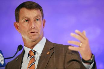 Clemson head coach Dabo Swinney answers a question during ACC Kickoff media days on Thursday in Charlotte, N.C. (NELL REDMOND/Associated Press)