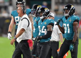 Jacksonville Jaguars head coach Urban Meyer tries to get his players attention late in the third quarter of play of Saturday’s preseason game against the Cleveland Browns at TIAA Bank Field in Jacksonville. (TRIBUNE NEWS SERVICE)