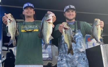 FGC’s Seth Slanker (left) and Jackson Swisher (right) pose with their winning fish at the Florida Bass Nation Bassmaster College Series qualifier on Lake Okeechobee earlier this season. (COURTESY)