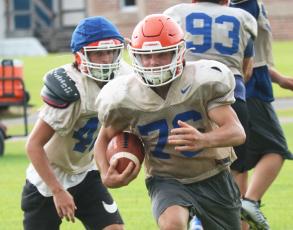 Branford running back Bodhi White takes off up the field during practice on Wednesday. (JAMIE WACHTER/Lake City Reporter)