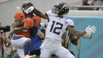 Denver Broncos cornerback Pat Surtain II intercepts a pass intended for Jacksonville Jaguars receiver Tyron Johnson on Sept. 19 in Jacksonville. (PHELAN M. EBENHACK/Associated Press)