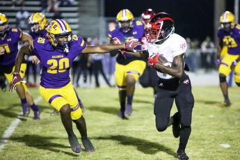 Columbia defensive back Kani Fulton chases down a Westside player on Friday night. (BRENT KUYKENDALL/Lake City Reporter)