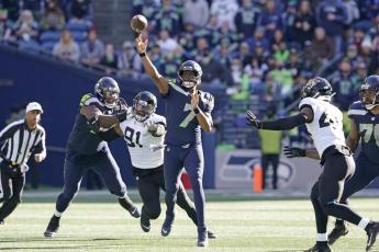 Seattle Seahawks quarterback Geno Smith throws a pass against the Jacksonville Jaguars on Sunday in Seattle. (TED S. WARREN/Associated Press)