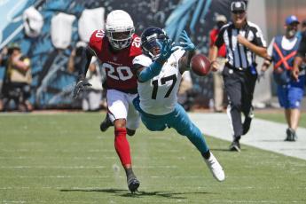 Jacksonville Jaguars wide receiver D.J. Chark dives but can't make a catch as he is defended by Arizona Cardinals cornerback Marco Wilson on Sept. 26 in Jacksonville. (STEPHEN B. MORTON/Associated Press)