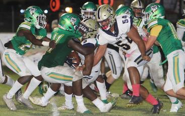 Suwannee linebacker Andrew Brown (11) stops Paxon running back Stephen Ikeokwu just short of the goal line on Friday. (PAUL BUCHANAN/Special to the Reporter)