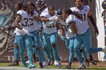 Jacksonville Jaguars players celebrate with wide receiver Jamal Agnew, second from right, after he ran back a missed field goal 109 yards for a touchdown against the Arizona Cardinals on Sept. 26 in Jacksonville. (PHELAN M. EBENHACK/Associated Press)