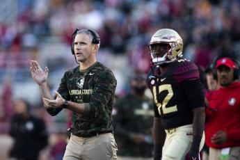Florida State coach Mike Norvell applauds during a game against N.C. State on Nov. 6 in Tallahassee. (MARK WALLHEISER/Associated Press)