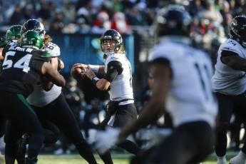 Jacksonville Jaguars quarterback Trevor Lawrence throws a pass to Marvin Jones (11) during Sunday’s game against the New York Jets in East Rutherford, N.J. (JOHN MUNSON/Associated Press)