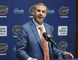 Florida head football coach Billy Napier speaks to the media during his introductory press conference on Sunday in Gainesville. (STEPHEN M. DOWELL/The Gainesville Sun via AP)