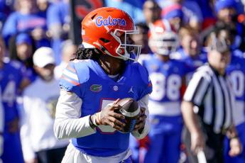 Florida quarterback Emory Jones looks for a receiver against Florida State on Nov. 27 in Gainesville, Fla. (JOHN RAOUX/Associated Press)
