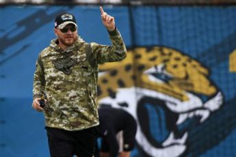 Jacksonville Jaguars interim head coach Darrell Bevell, an offensive coordinator under former coach Urban Meyer, leads practice on Thursday at TIAA Bank Field's practice field in Jacksonville. Bevell took over after Meyer was fired. (COREY PERRINE/Florida Times-Union via AP)