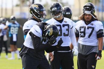 Jacksonville Jaguars defensive end Jihad Ward (6) dances in front of teammates defensive tackles Doug Costin (58), Taven Bryan (93) and Jay Tufele (97) during practice on Thursday at TIAA Bank Field's practice field in Jacksonville. (COREY PERRINE/The Florida Times-Union/TNS)