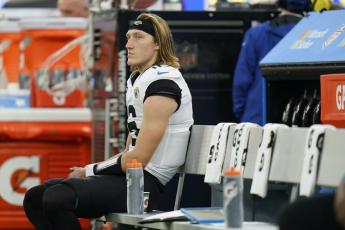 Jacksonville Jaguars quarterback Trevor Lawrence sits on the bench in the closing minutes of Sunday's loss to the Los Angeles Rams in Inglewood, Calif. (JAE C. HONG/Associated Press)